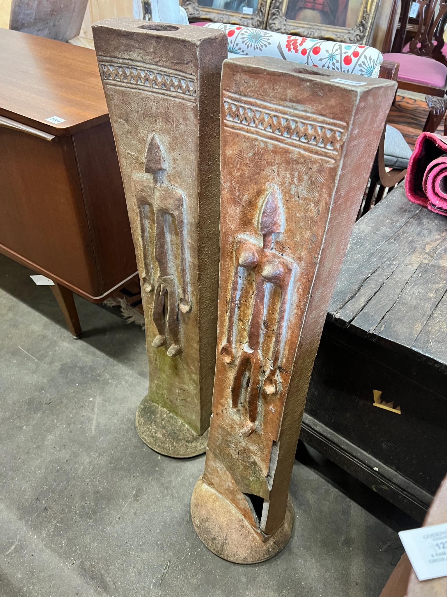 A pair of “Adam and Eve” studio pottery columns height 91 cms.